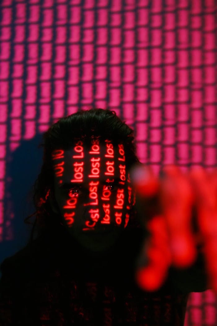 A mysterious portrait with 'lost' text projected onto a person's face, creating an enigmatic ambiance.